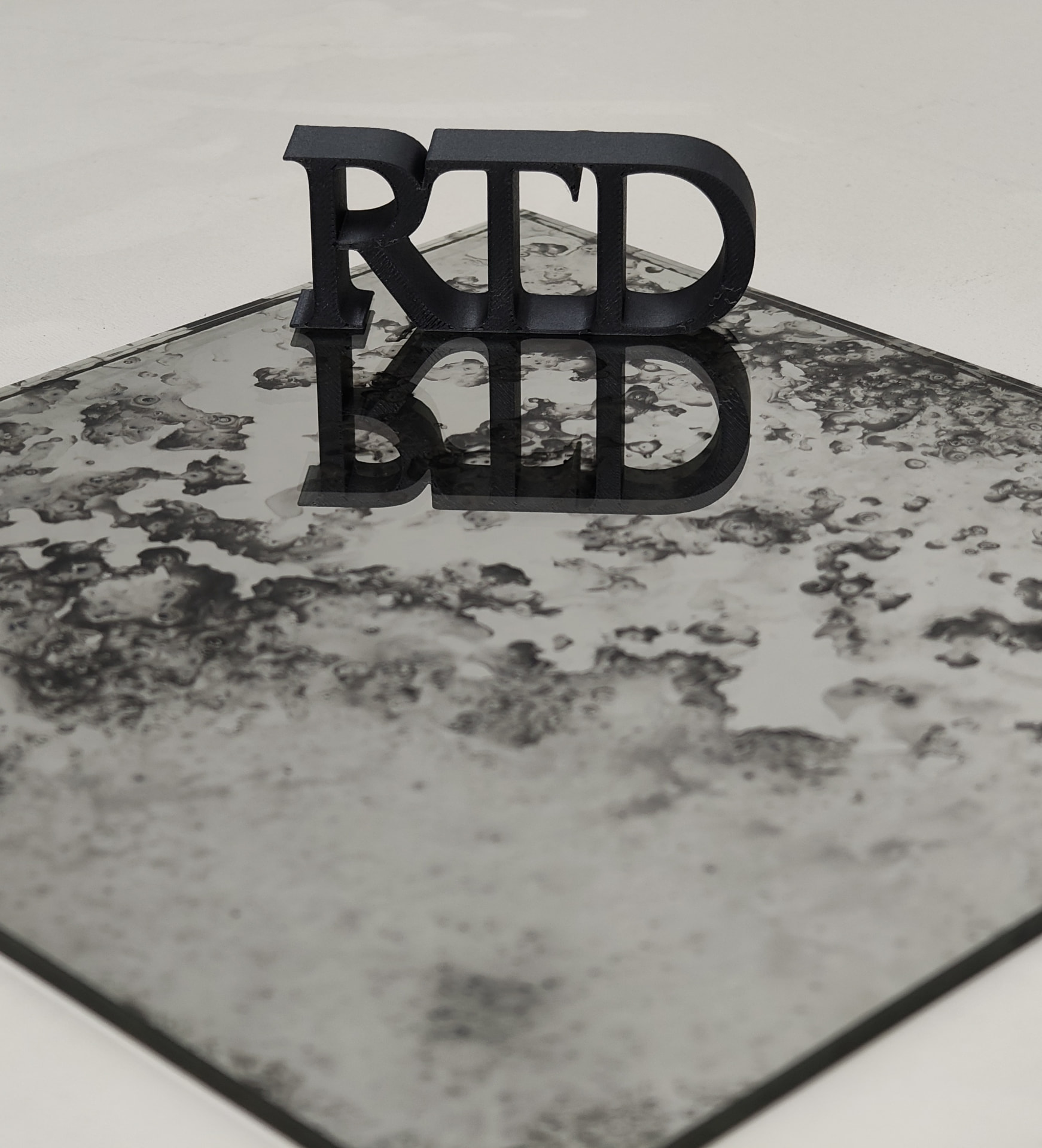 RTD Mirrors sign on an antique mirror surface
