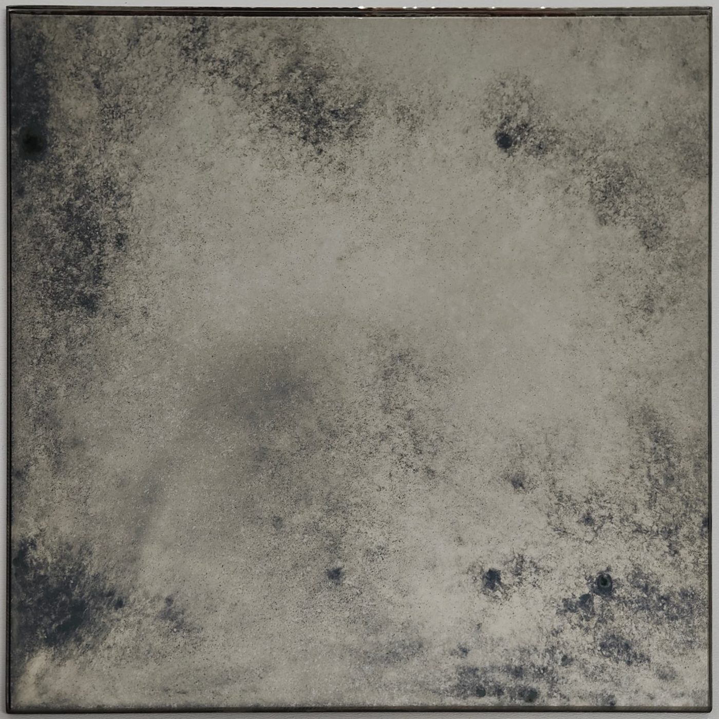 Timeworn antique mirror panel with soft aged patina